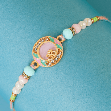 Studded Om Design Rakhi by Shree Rakhi