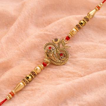 Glorious Om Rakhi with Roli Chawal and Greeting by Riddhika Ventures