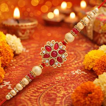 Floral Pearl Rakhi Set with Roli Chawal by Riddhika Ventures